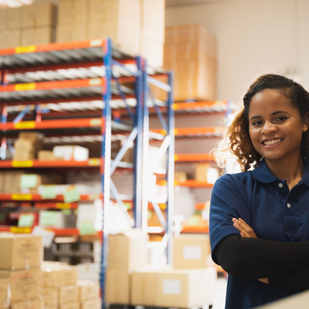 African American worker person working with safety in warehouse logistic factory, business manufacturing industry occupation concept, goods product box distribution service livraison rdc